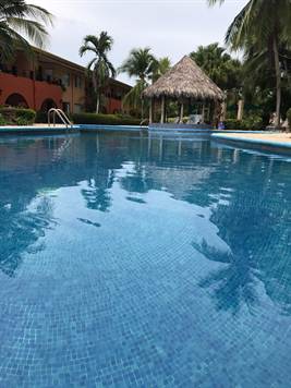 CONDO - 2 Bedroom Ground Floor Unit With Shared Pool At Isla Damas!!