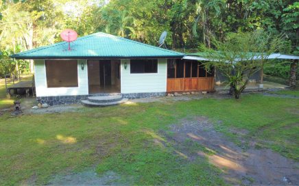 1.27 ACRES – 2 Bedroom Home With Creek, Room To Build More, Easy Beach Access!!!!